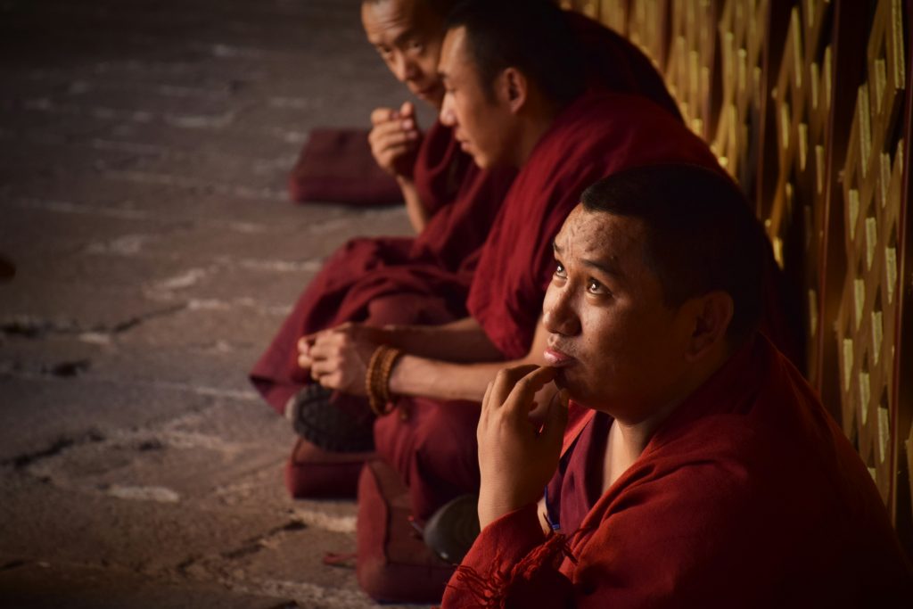 Buddhist monks inside Jokhang temple in Lhasa, Tibet